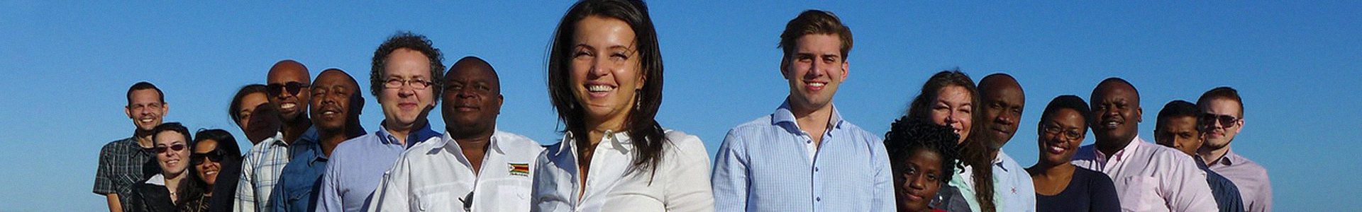 Diplo Alumni page_2021_1920x300px People, Person, Clothing, Shirt, Head, Groupshot, Face, Adult, Female, Woman, Male, Man, Happy, Photography, Smile, Coat